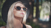 Woman walking by the beach in Wildwood Sunglasses